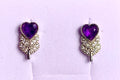 Amethyst earrings with heart and leaf.
