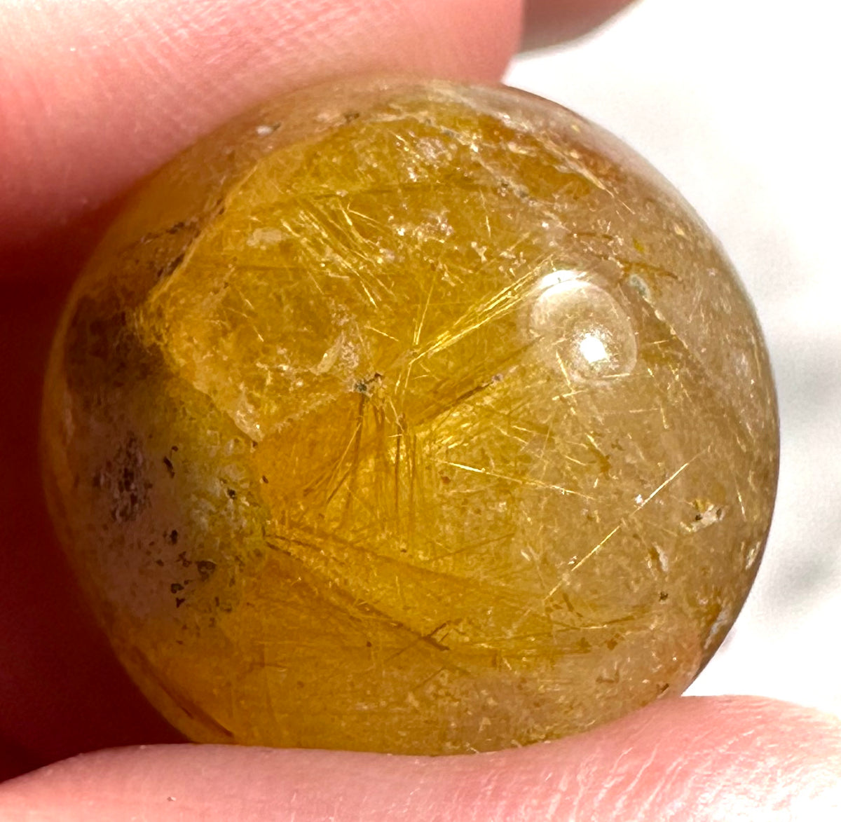 Small spheres in rutilated quartz