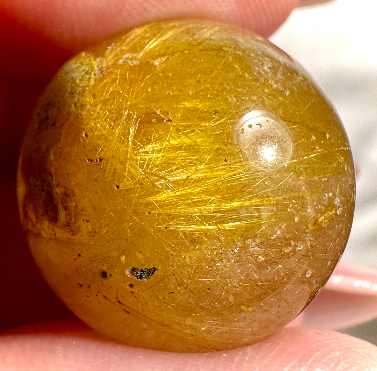 Small spheres in rutilated quartz