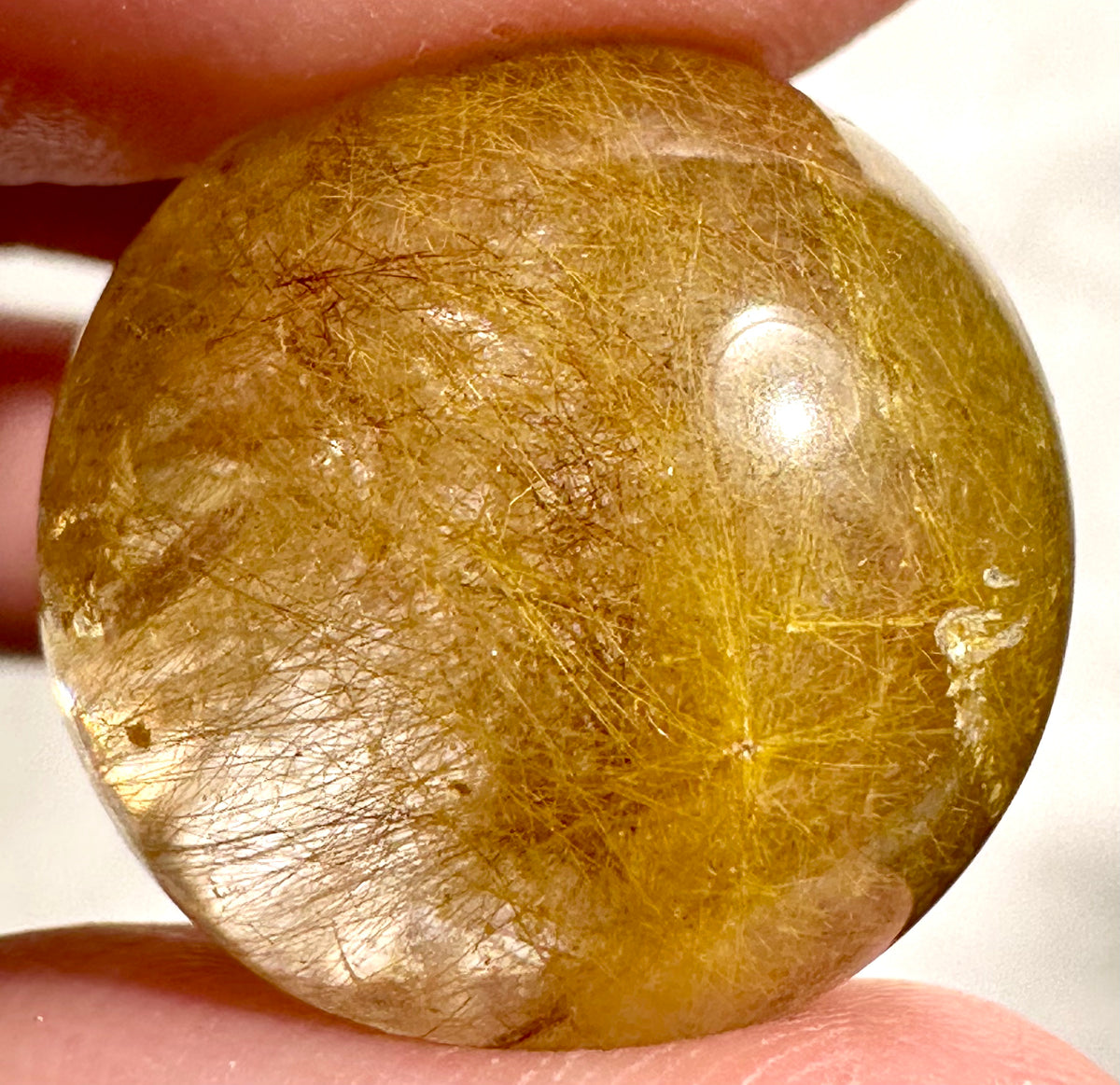 Small spheres in rutilated quartz