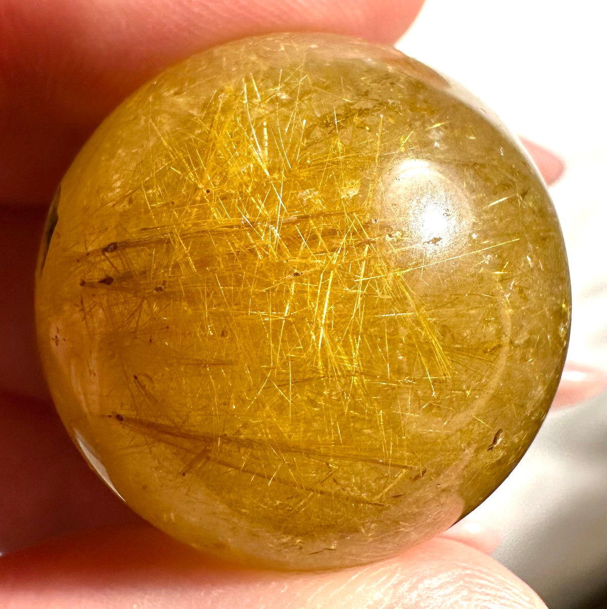 Small spheres in rutilated quartz