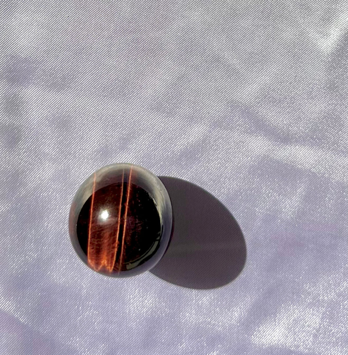 Sphere in red tiger's eye (or bull's eye)