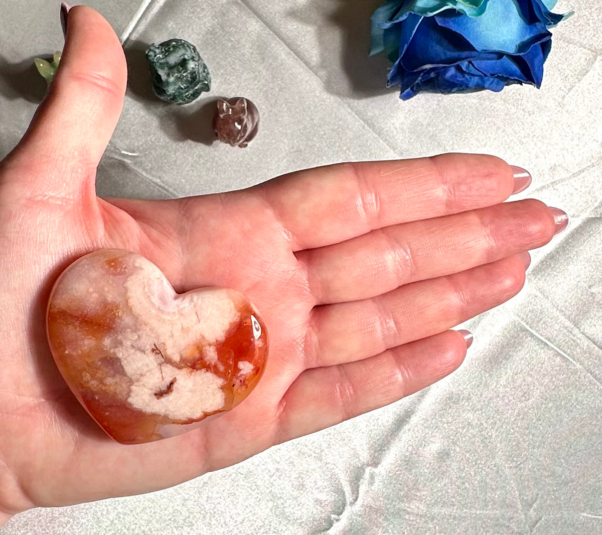 Heart and palmstone in sakura agate with carnelian inclusions