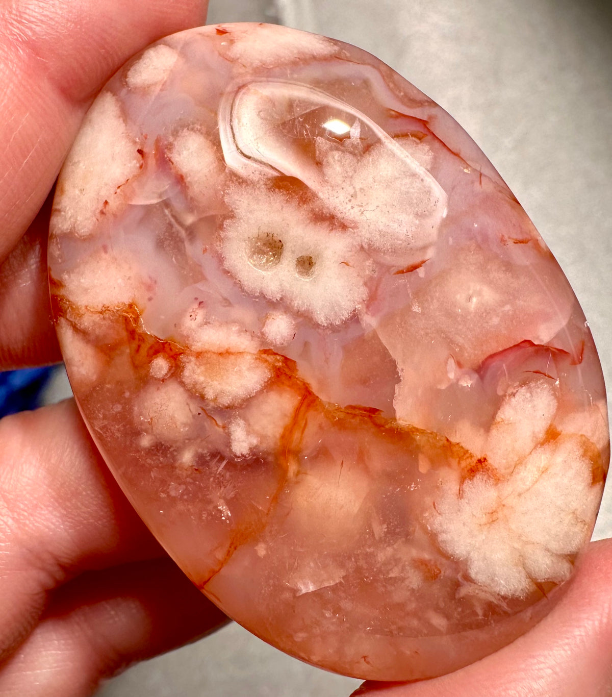 Heart and palmstone in sakura agate with carnelian inclusions