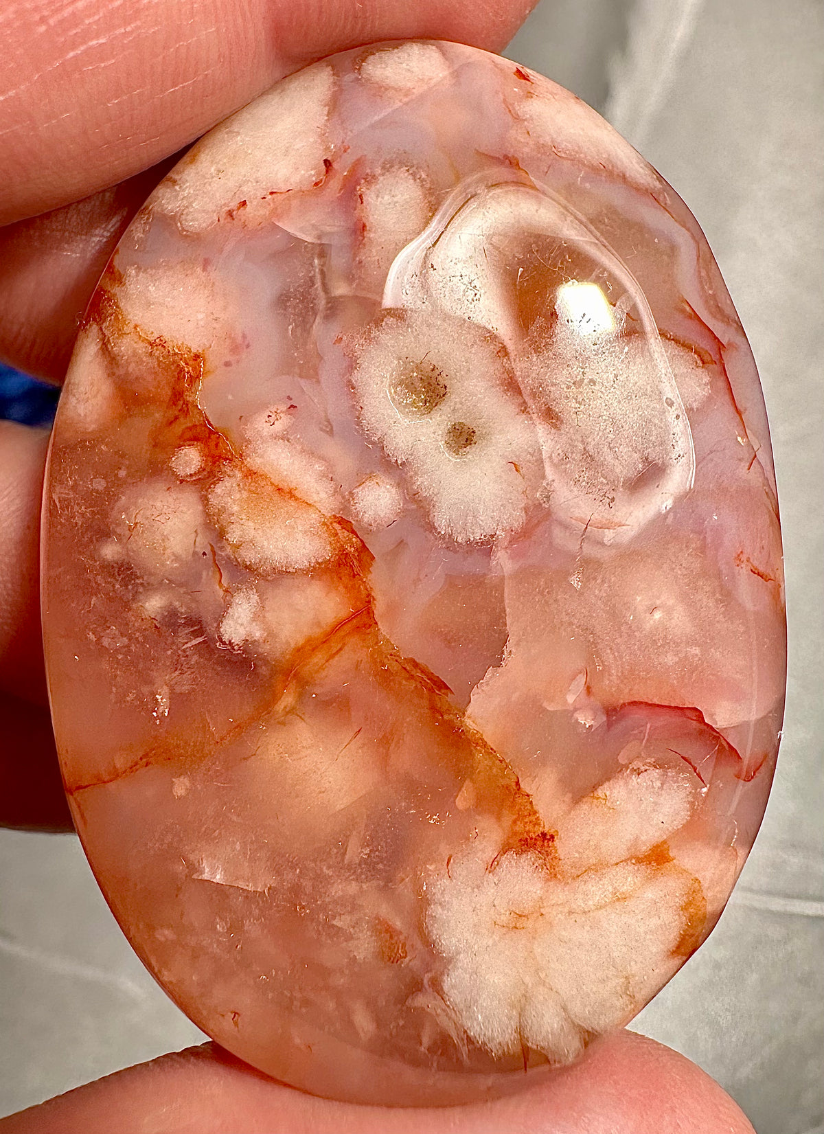 Heart and palmstone in sakura agate with carnelian inclusions